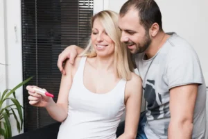 couple looks at pregnancy test
